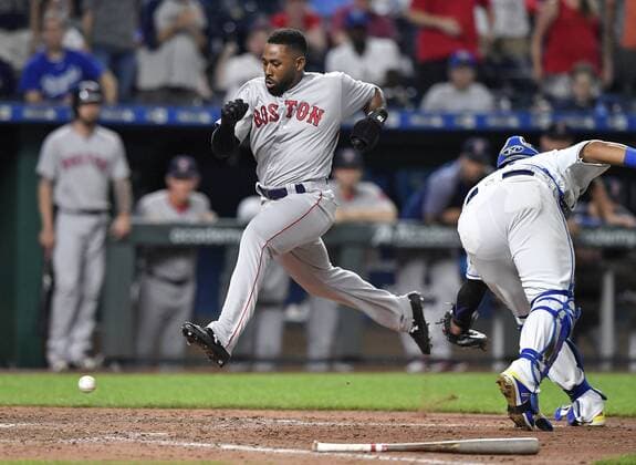 July 7, 2018 - Kansas City, MO, USA - The Boston Red Sox s Jackie Bradley Jr. scores past the throw to Kansas City Royals catcher Salvador Perez on a triple by Mookie Betts in the ninth inning at Kauffman Stadium in Kansas City, Mo., on Saturday, July 7, 2018. The Red Sox won, 15-4. Boston at Kansas City - ZUMAm67_ 20180707_zaf_m67_043 Copyright: xJohnxSleezerx