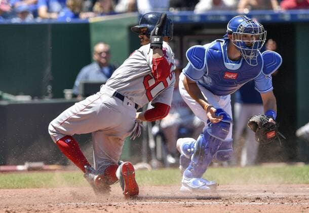 July 8, 2018 - Kansas City, MO, USA - Boston Red Sox s Mookie Betts scores before the tag from Kansas City Royals catcher Drew Butera on a sacrifice fly by Steve Pearce in the third inning during Sunday s baseball game on July 8, 2018, at Kauffman Stadium in Kansas City, Mo. Red Sox vs Royals - ZUMAm67_ 20180708_zaf_m67_008 Copyright: xJohnxSleezerx