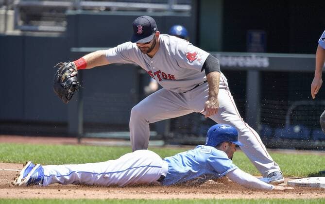 July 8, 2018 - Kansas City, MO, USA - Kansas City Royals Whit Merrifield gets back to first before the throw to Boston Red Sox first baseman Mitch Moreland on a fly ball out by Jorge Bonifacio in the first inning during Sunday s baseball game on July 8, 2018, at Kauffman Stadium in Kansas City, Mo. Red Sox vs Royals - ZUMAm67_ 20180708_zaf_m67_013 Copyright: xJohnxSleezerx