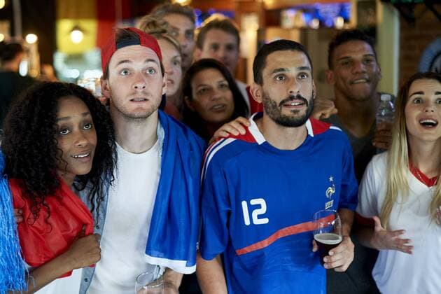 French football fans watching soccer match on television at pub  Copyright: FrédéricxCirou B65760637