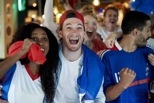 French football fans watching soccer match on television at pub  Copyright: FrédéricxCirou B68560537