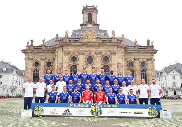 The team of the 1 FC Saarbrücken on Thursday 12 07 2018 in front of the Ludwigskirche in Saarbrücken In the picture Upper row from Marco Holz 14 Macel Carl 22 Steven Zellner 5 Alexandre Mendy 4 Benjamin Kessel 15 Oliver Oschkenat 3 Nino Miotke 28 Jose Pierre Vunguidica 9 Sebastian Jacob 24 and Marco Kehl Gomez Intermediate Series Robert Roelofsen Co Trainer Dirk Lottner Head Coach Christoph Fuhr Athletic Trainer Heinz Böhmann Goalkeeper Coach Gillian Jurcher 21 Lukas Quirin 31 Markus Obernosterer 10 Manuel Zeitz 8 Tobias Jänicke 25 Pierre Fassnacht 29 Helmut Schwan Supervisor Rüdiger Schmid Kit Officer Paulo da Palma Physiotherapist and Frank Kackert Goalkeeper Coach Bottom row by Fatih Köksal 27 Sascha Wenninger 19 Fanol Perdedaj 17 Ricco Cymer 20 Daniel Batz 1 Martin Dausch 7 Markus Mendler 11 and Mario Müller 23
