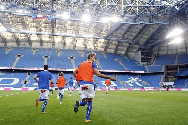 12.07.2018 POZNAN, UL. BULGARSKA PILKA NOZNA (FOOTBALL), 1 RUNDY ELIMINACJI DO LIGI EUROPY (UEFA EUROPA LEAGUE , FIRST QUALIFYING ROUND) MECZ (GAME) LECH POZNAN - GANDZASAR KAPAN NZ. PILKARZE LECH POZNAN WYCHODZA NA THOMAS ROGNE ROZGRZEWKE ILUSTRACJA MECZ BEZ UDZIALU KIBICOW PUSTE TRYBUNY FOTO JAKUB PIASECKI CYFRASPORT NEWSPIX.PL --- Newspix.pl  20180712CSJP3040