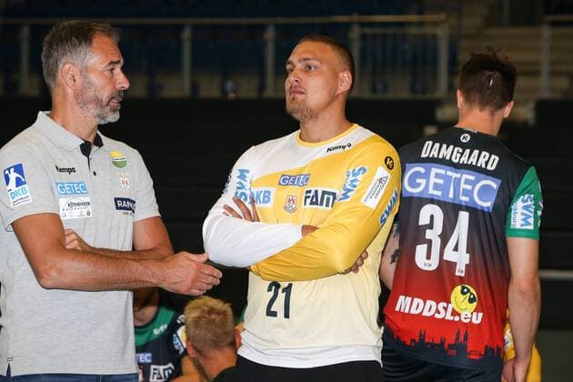Goalkeeper Dario Quenstedt with goalkeeping coach Tomas Runar Svensson SC Magdeburg 1 BL Handball Bundesliga season 2018 2019 official photo session Portrait date 2018 2019 SC Magdeburg in the GETEC Arena in Magdeburg Germany Handball man men 11 11 2018