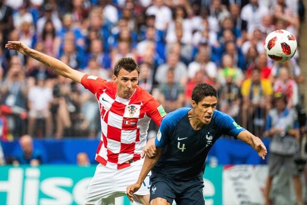 180715 Mario Mandzukic of Croatia and Raphael Varane of France competes for the ball during the FIFA World Cup final match between France and Croatia on July 15, 2018 in Moscow Photo Petter Arvidson BILDBYRAN Code PA 92087  Copyright: PETTERxARVIDSON BB180715PA036