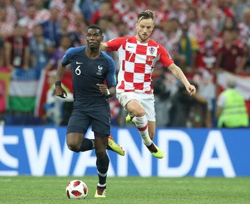 Paul Pogba of France gets clear of Ivan Rakitic of Croatia during the FIFA World Cup WM Weltmeisterschaft Fussball 2018 Final at the Luzhniki Stadium, Moscow. Picture date 15th July 2018. Picture credit should read: David Klein Sportimage EDITORIAL USE ONLY. No use with unauthorised audio, video, data, fixture lists, club league logos or live services. Online in-match use limited to 120 images, no video emulation. No use in betting, games or single club league player publications.