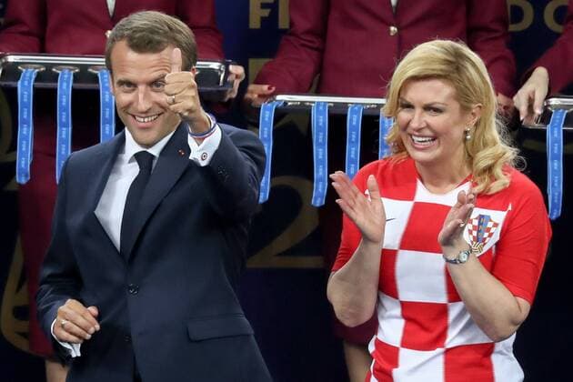 MOSCOW, RUSSIA - JULY 15, 2018: France s President Emmanuel Macron (L) and Croatia s President Kolinda Grabar-Kitarovic during an award ceremony after the 2018 FIFA World Cup WM Weltmeisterschaft Fussball Final match between France and Croatia at Luzhniki Stadium. Stanislav Krasilnikov TASS  TS089A97