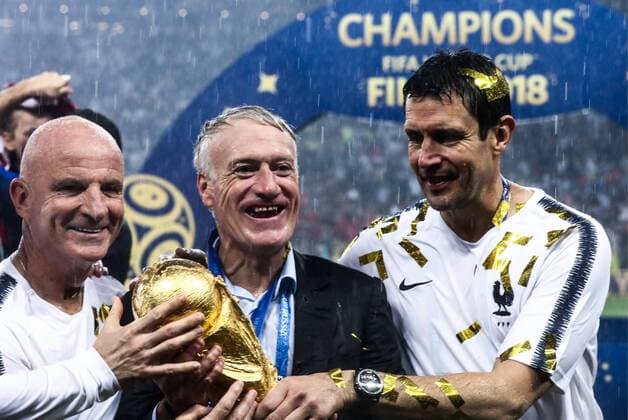 MOSCOW, RUSSIA - JULY 15, 2018: France s manager Didier Deschamps (C) holds the trophy during an award ceremony after the 2018 FIFA World Cup WM Weltmeisterschaft Fussball Final match between France and Croatia at Luzhniki Stadium. Valery Sharifulin TASS  TS089AA5