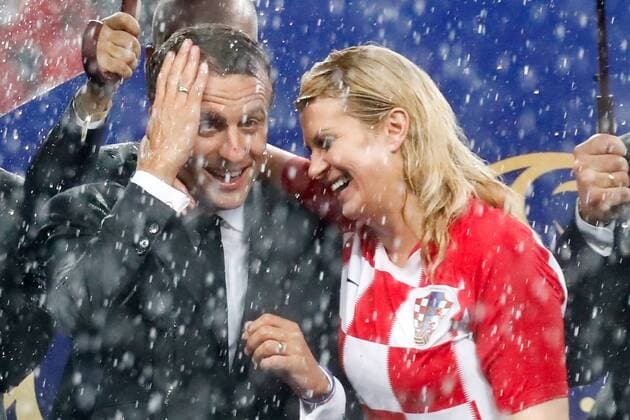 MOSCOW, RUSSIA â€“ JULY 15, 2018: France s President Emmanuel Macron (L) and Croatia s President Kolinda Grabar-Kitarovic at a victory ceremony after the 2018 FIFA World Cup WM Weltmeisterschaft Fussball final football match between France and Croatia at Luzhniki Stadium. Team France won the game 4:2 and claimed the World Cup title. Mikhail Metzel TASS  TS089AA6