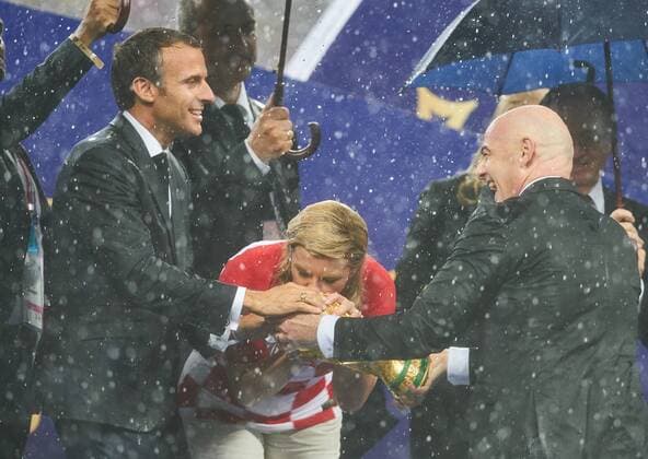 France - Croatia, Soccer, Moscow, July 15, 2018 Emmanuel Macron, President France, Kolinda Grabar-Kitarovic, President Croatia kisses the Official FIFA World Cup WM Weltmeisterschaft Fussball Original Trophy, next to Gianni Infantino (SUI) FIFA President, winner, victory, ceremony, FRANCE - CROATIA 4-1 Football FIFA WORLD CUP 2018 RUSSIA, Final, Season 2018 2019, July 15, 2018 in Luzhniki Stadium Moscow, Russia. Photo: MAGICS Peter Schatz