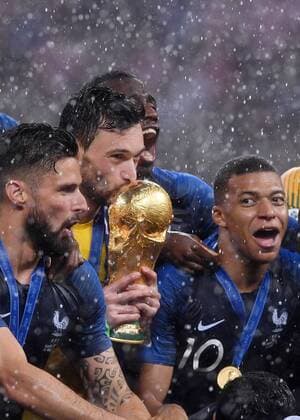 FIFA World Cup 2018 Final 15 07 2018 France Croatia Award ceremony World Champion France Goalkeeper Hugo Lloris Center kisses the World Cup trophy Olivier Giroud li and Kylian Mbappe re cheer