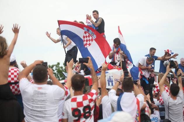 Gathered citizens welcome the Croatian football team 16.07.2018., Croatia, Zagreb - Gathered citizens welcome the Croatian football team after returning from the World Cup, where they won the silver medal. Domagoj Vida, Luka Modric, Mario mandzukic, Sime Vrsaljko, Vedran Corluka  ZarkoxBasic PIXSELL