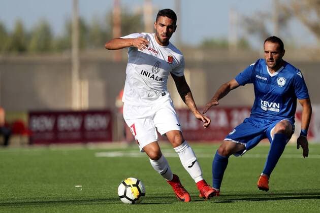 17 07 2018 - National Stadium, Ta Qali, Malta UEFA Champions League 2018 2019 First Qualifying Round, 2nd Leg - Valletta FC v FK Kuk‘si Miguel Alba of Valletta FC (L) about to be challenged by Donjet Shkodra of FK Kuk‘si (R_ during the UEFA Champions League 2018 19 First Qualifying Round, 2nd Leg match between Valletta FC of Malta FK Kuk‘si of Albania, at the Centenary Stadium, Ta Qali, Malta on 17 July, 2018. FK Kuk‘si drew 1-1 against Valletta FC and qualified on the away goals rule to progress into the UEFA Champions League competition. Valletta FC v FK Kuk‘si - UEFA Champions League 2018 19 UCL_18_19
