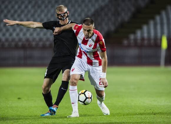17th July 2018, Rajko Mitic Stadium, Belgrade, Serbia; UEFA Champions League Qualification, first qualifying round, 2nd leg, Red Star Belgrade versus Spartaks Jurmala; Defender Milan Rodic of Red Star Belgrade shields the ball against Defender Gints Freimanis of Spartak Jurmala  ActionPlus12048450 NikolaxKrstic