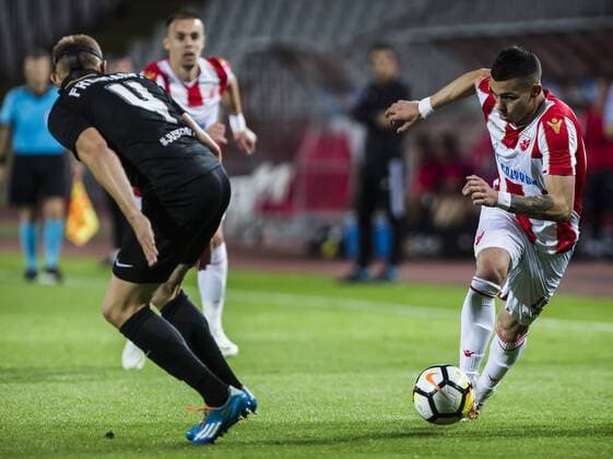 17th July 2018, Rajko Mitic Stadium, Belgrade, Serbia; UEFA Champions League Qualification, first qualifying round, 2nd leg, Red Star Belgrade versus Spartaks Jurmala; Midfielder Nemanja Radonjic of Red Star Belgrade takes on Defender Gints Freimanis of Spartak Jurmala  ActionPlus12048453 NikolaxKrstic
