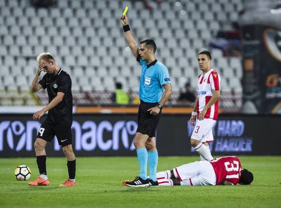 17th July 2018, Rajko Mitic Stadium, Belgrade, Serbia; UEFA Champions League Qualification, first qualifying round, 2nd leg, Red Star Belgrade versus Spartaks Jurmala; The referee gives a yellow card to Forward Evgeni Kobzar of Spartak Jurmala after the foul on Forward El Fardou Ben Nabouhane of Red Star Belgrade  ActionPlus12048461 NikolaxKrstic
