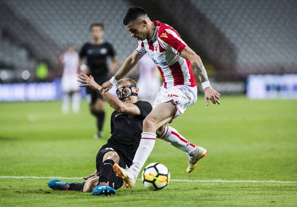 17th July 2018, Rajko Mitic Stadium, Belgrade, Serbia; UEFA Champions League Qualification, first qualifying round, 2nd leg, Red Star Belgrade versus Spartaks Jurmala; Defender Gints Freimanis of Spartak Jurmala blocks Midfielder Nemanja Radonjic of Red Star Belgrade  ActionPlus12048462 NikolaxKrstic