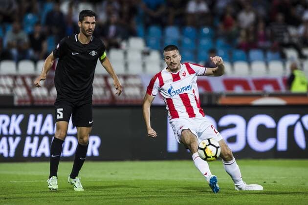 17th July 2018, Rajko Mitic Stadium, Belgrade, Serbia; UEFA Champions League Qualification, first qualifying round, 2nd leg, Red Star Belgrade versus Spartaks Jurmala; Midfielder Milan Jevtovic of Red Star Belgrade turns inside against Defender Aleksandar Kosoric of Spartak Jurmala  ActionPlus12048473 NikolaxKrstic