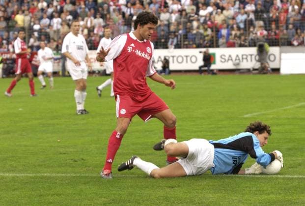Michael Ballak of Bayern Munich plays on Saturday 30 08 2003 in the DFB Cup match against goalkeeper Sascha Purket of Borussia Neunkirchen Ellenfeldstadion in Neunkirchen Saar