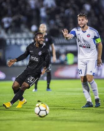 19th July 2018, Partizan Stadium, Belgrade, Serbia; UEFA Europa League football, first qualifying round, 2nd leg, Partizan versus Rudar Pljevlja; Midfielder Seydouba Soumah of Partizan watches as Milija Golubovic of Rudar Pljevlja gives instructions for a clearance  ActionPlus12048805 NikolaxKrstic