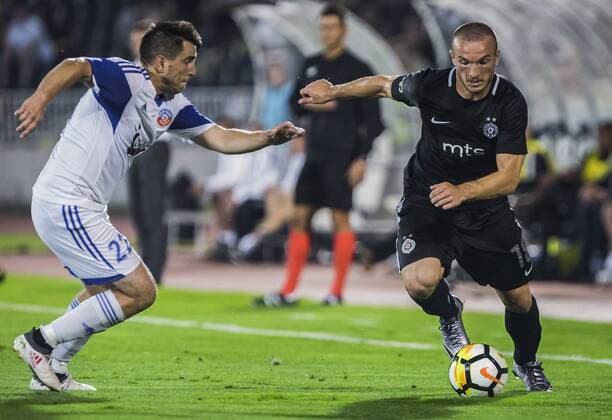 19th July 2018, Partizan Stadium, Belgrade, Serbia; UEFA Europa League football, first qualifying round, 2nd leg, Partizan versus Rudar Pljevlja; Midfielder Djordje Ivanovic of Partizan takes on Defender Zeljko Tomasevic of Rudar Pljevlja  ActionPlus12048810 NikolaxKrstic