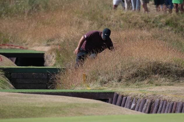 America s Patrick Reed loses his footing in the rough on the first day of the 2018 Open Golf championships in Carnoustie, Scotland on July 19, 2018.  LON2018071920 HUGOxPHILPOTT