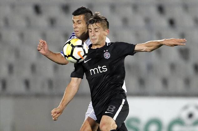 (180720) -- BELGRADE, July 20, 2018 -- Partizan s Armin Djerlek (R) vies with Rudar s Armin Bosnjak during the first qualifying round UEFA Europa League football match between Partizan and Rudar in Belgrade, Serbia on July 19, 2018. Partizan won 3-0. ) (SP)SERBIA-BELGRADE-UEFA-FOOTBALL-PARTIZAN VS RUDAR PredragxMilosavljevic 