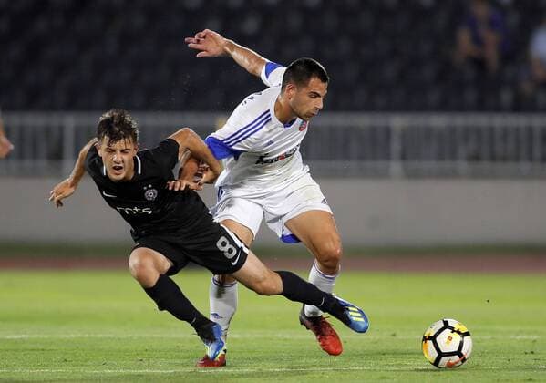 (180720) -- BELGRADE, July 20, 2018 -- Partizan s Armin Djerlek (L) vies with Rudar s Dejan Kotorac during the first qualifying round UEFA Europa League football match between Partizan and Rudar in Belgrade, Serbia on July 19, 2018. Partizan won 3-0. ) (SP)SERBIA-BELGRADE-UEFA-FOOTBALL-PARTIZAN VS RUDAR PredragxMilosavljevic 
