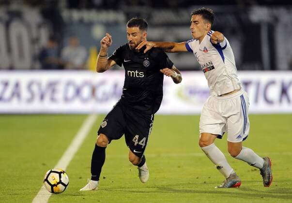 (180720) -- BELGRADE, July 20, 2018 -- Partizan s Gabriel Enache (L) vies with Rudar s Nemanja Sekulic during the first qualifying round UEFA Europa League football match between Partizan and Rudar in Belgrade, Serbia on July 19, 2018. Partizan won 3-0. ) (SP)SERBIA-BELGRADE-UEFA-FOOTBALL-PARTIZAN VS RUDAR PredragxMilosavljevic 