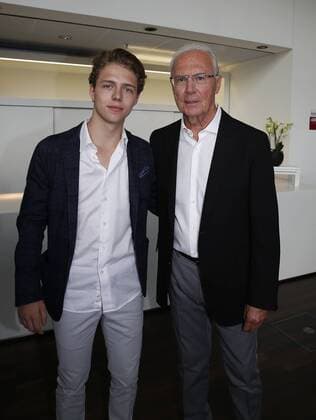 Bavarian Sports Award of the Prime Minister Franz Beckenbauer is awarded the title of Sportsman of Bavaria Franz Beckenbauer is awarded Sportsman of the Century Franz Beckenbauer and his son Joel Münchdn Bavaria Germany BMW Welt