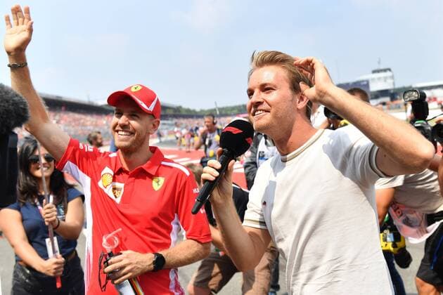 Sebastian VETTEL GER Scuderia Ferrari and Nico ROSBERG EX Formula 1 world champion greeting the fans waving waving surrounded by photographer Formula 1 GP of Germany race Hockenheimring season 2018 on 22 07 2018