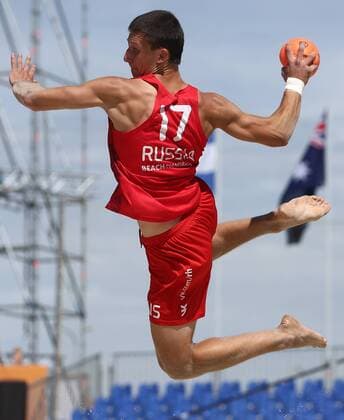 KAZAN, RUSSIA - JULY 24, 2018: Russia s Yegor Kochura in action in a beach handball match against Sweden at the 2018 IHF Menâ€™s and Womenâ€™s Beach Handball World Championships held in Kazan. Yegor Aleyev TASS  TS08A8B4