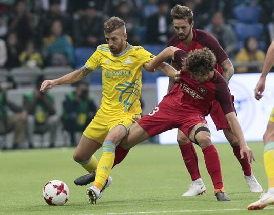 FCMs Alexander Munksgaard and Henrique vie for the ball during the UEFA Champions League second qualifying round first leg football match between FC Astana and FC Midtjylland in Astana on July 24, 2018. , Denmark  Copyright: ALEXEIxFILIPPOVx cop108 spdk20180724-172714-L