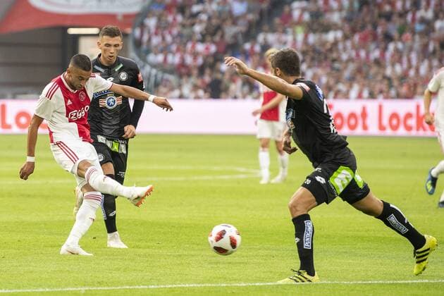 AMSTERDAM, Ajax - Sturm Graz , football, season 2018-2019, Johan Cruijff Arena , 25-07-2018, Johan Cruijff ArenA , UEFA Champions League second qualifying round , 1st leg , Ajax player Hakim Ziyech scores the 1-0 during the match Ajax - Sturm Graz Ajax - Sturm Graz  x2363550x