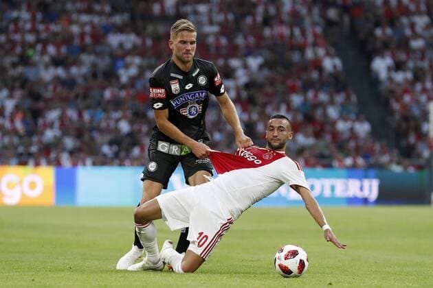 (L-R) Lukas Grozurek of Sturm Graz, Hakim Ziyech of Ajax during the UEFA Champions League second round qualifying first leg match between Ajax Amsterdam and Sturm Graz at the Johan Cruijff Arena on July 25, 2018 in Amsterdam, The Netherlands UEFA Champions League 2018 2019 xVIxVIxImagesx xMauricexvanxSteenxIVx 11586420
