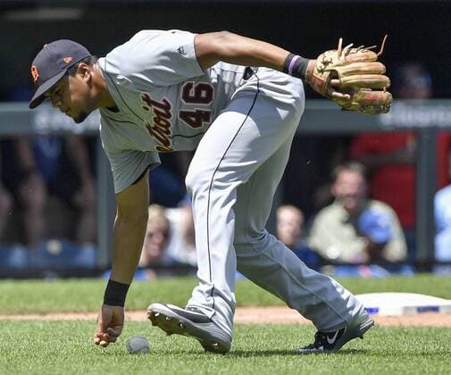 July 25, 2018 - Kansas City, MO, USA - Detroit Tigers third baseman Jeimer Candelario misses picking up a bunt single by Detroit Tigers Alcides Escobar in the second inning on Wednesday, July 25, 2018 at Kauffman Stadium in Kansas City, Mo. Detroit Tigers vs. Kansas City Royals - ZUMAm67_ 20180725_zaf_m67_021 Copyright: xJohnxSleezerx