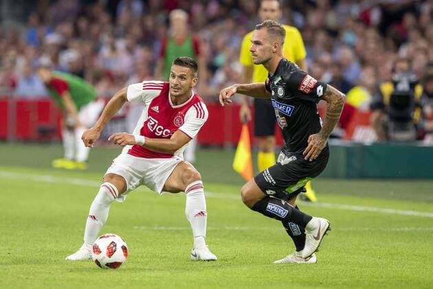 AMSTERDAM, Ajax - Sturm Graz , football, season 2018-2019, Johan Cruijff Arena , 25-07-2018, Johan Cruijff ArenA , UEFA Champions League second qualifying round , 1st leg , Ajax player Dusan Tadic and Sturm Graz player Lukas Spendlhofer during the match Ajax - Sturm Graz Ajax - Sturm Graz  x2363707x