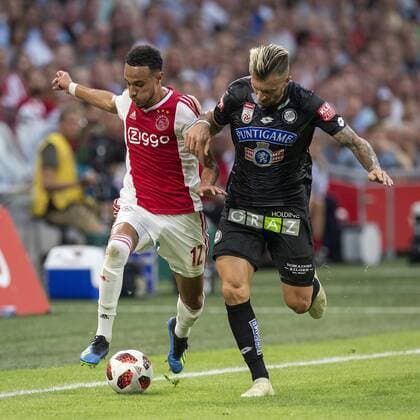 AMSTERDAM, Ajax - Sturm Graz , football, season 2018-2019, Johan Cruijff Arena , 25-07-2018, Johan Cruijff ArenA , UEFA Champions League second qualifying round , 1st leg , Ajax player Noussair Mazraoui and Sturm Graz player Peter Zulj during the match Ajax - Sturm Graz. Finals score 2-0 . Ajax - Sturm Graz  x2363783x