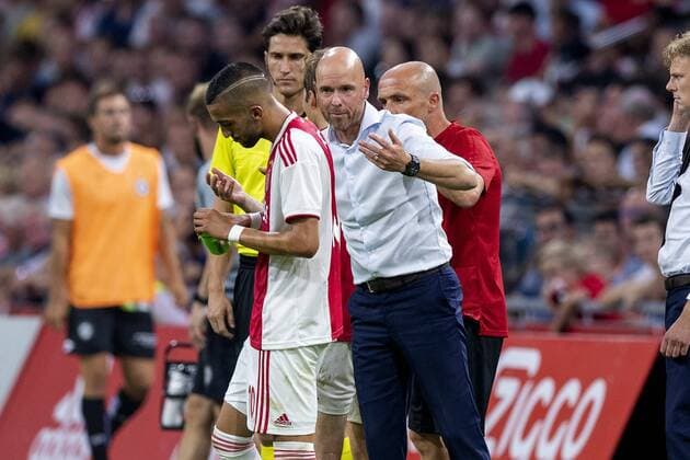 AMSTERDAM, Ajax - Sturm Graz , football, season 2018-2019, Johan Cruijff Arena , 25-07-2018, Johan Cruijff ArenA , UEFA Champions League second qualifying round , 1st leg , Ajax player Hakim Ziyech and Ajax coach Erik ten Hag during the match Ajax - Sturm Graz. Finals score 2-0 . Ajax - Sturm Graz  x2363788x