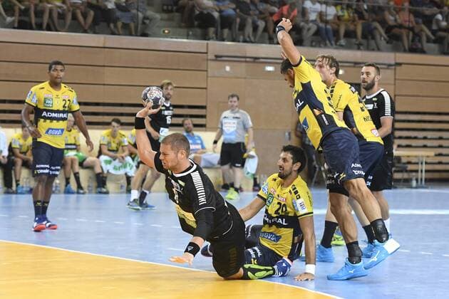 Rhein Vikings vs Rhein Neckar Löwen on 25 07 2018 at the Castello in Dusseldorf Rhein Viking Teo Coric No. 18 defeats Rhein Neckar Loewe Ilja Abutovic No. 20 and Rhein Neckar Loewe Mads Mensah Larsen No. 22 wd