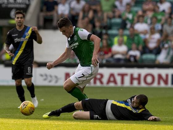 26th July 2018, Easter Road, Edinburgh, Scotland; UEFA Europa League 2nd qualifying round, 1st leg, Hibernian versus Asteras Tripolis; John McGinn of Hibernian skips past the tackle from Nikos Kaltsas of Asteras Tripoli  ActionPlus12050648 AlanxRennie