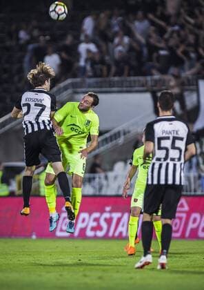 26th July 2018, Partizan Stadium, Belgrade, Serbia; UEFA Europa League 2nd qualifying round, 1st leg, FK Partizan versus FK Trakai; Nebojsa Kosovic of Partizan challenges Valentin Jeriomenko of Trakai for the high ball  ActionPlus12050678 NikolaxKrstic