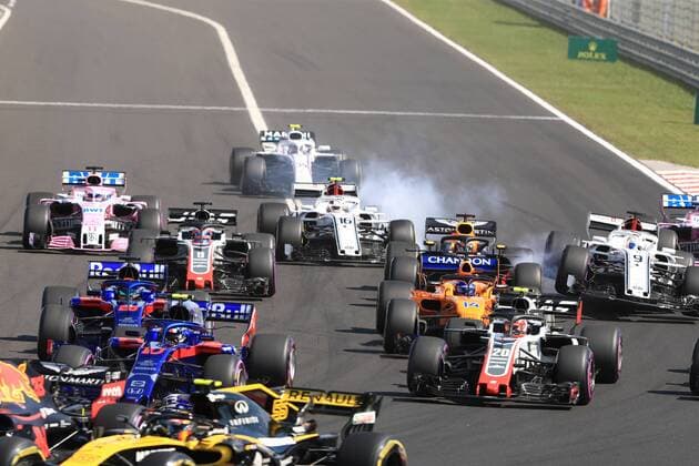 29th July 2018, Hungaroring, Mogyorod, Hungary; Hungarian Formula One Grand Prix, race day; Alfa Romeo Sauber F1 Team, Charles Leclerc locks up his brakes into Turn 1 while team mate Marcus Ericsson gets launched  ActionPlus12051521 Octane