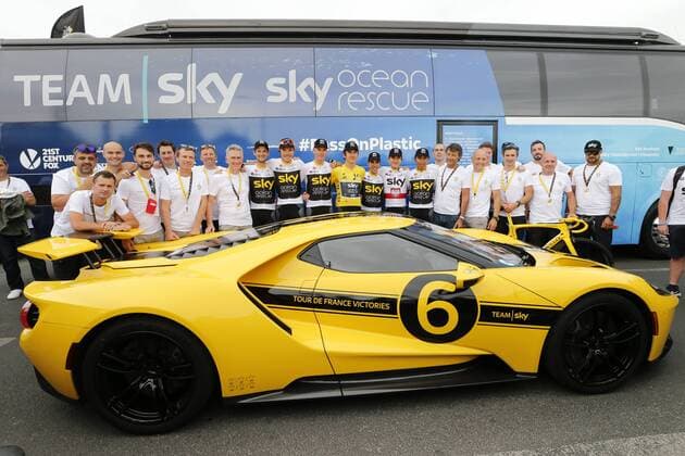 The riders and mechanics and team staff of Team Sky pose with a yellow personalized Ford GT sports car, after the last stage of the 105th edition of the Tour de France cycling race, 116km from Houilles to Paris, France, Sunday 29 July 2018. This year s Tour de France takes place from July 7th to July 29th. POOLxYUZURUxSUNADA  x05395150x