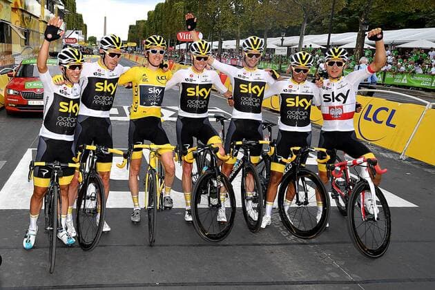 Team Sky riders with British Geraint Thomas of Team Sky wearing the yellow jersey of overall leader and British Chris Froome of Team Sky pose for the photographer after the last stage of the 105th edition of the Tour de France cycling race, 116km from Houilles to Paris, France, Sunday 29 July 2018. This year s Tour de France takes place from July 7th to July 29th. DAVIDxSTOCKMAN  x05395222x