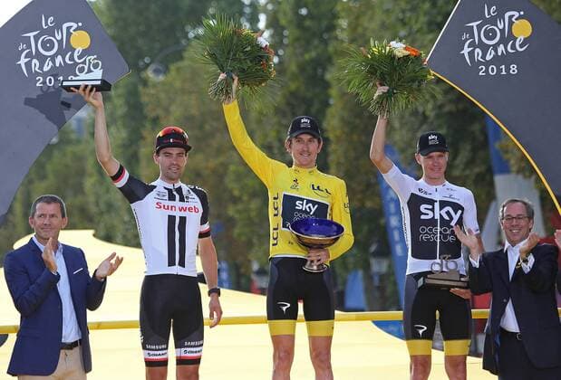 Tom Dumoulin of The Netherlands (L), Geraint Thomas of Great Britain (C) and Chris Froome of Great Britain arrive on the presentation podium after the conclusion of the Tour de France in Paris on July 29, 2018. Thomas claimed his first Tour de France victory, becoming the first Welshman to win the event.  PAR20180729036 DAVIDxSILPA