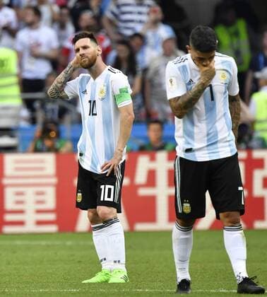 Football: France vs Argentina at World Cup Lionel Messi (L) of Argentina and his teammate Ever Banega look dejected after losing 4-3 to France in a World Cup round-of-16 match against France in Kazan, Russia, on June 30, 2018. 