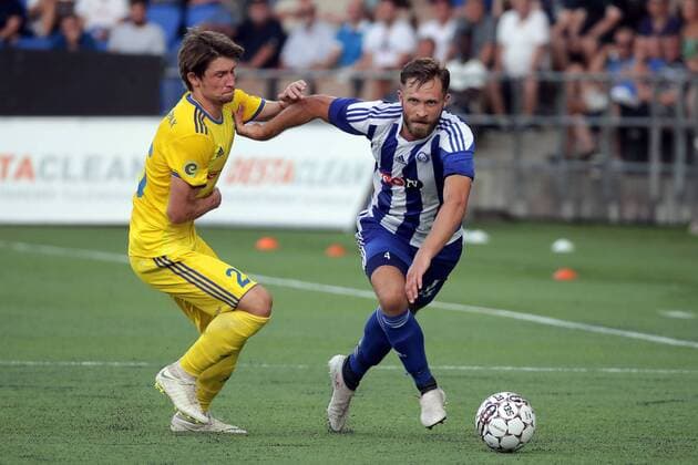 Dmitri Baga 25, BATE, BLR and Hannu Patronen 4, HJK Helsinki, FIN during their UEFA Champions League 2QR match HJK Helsinki - BATE in Telia 5G Arena 1. August 2018 in Helsinki, Finland.  Copyright: xMattixMatikainenx NP24_00311726