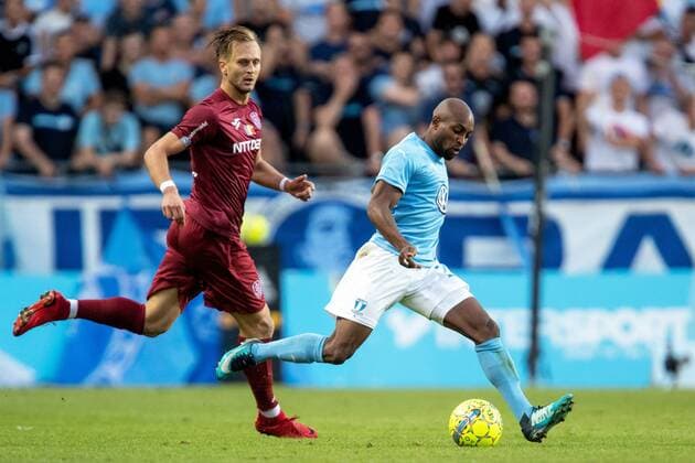 180801 Damjan Ä okovic of Cluj and Fouad Bachirou of Malmö FF during the UEFA Champions League qualifying match between Malmö FF and Cluj on August 1, 2018 in Malmö Photo Mathilda Ahlberg BILDBYRAN Cop 178  Copyright: MATHILDAxAHLBERG BB180801MA024