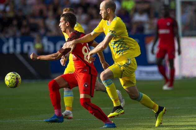 Fußball, CL Qualifikation, FC Midtjylland - FK Astana Gustav Wikheim ( 88 - FC Midtjylland ) in action with Ivan Mayewski ( 18 - FC Astana ) during UEFA Champions League, Second Qualifying Round between FC Midtjylland and FC Astana, August 1, 2018 in ARENA Herning, Denmark. , Herning Denmark  BoxAmstrupx cop103 spdk20180801-200039-L